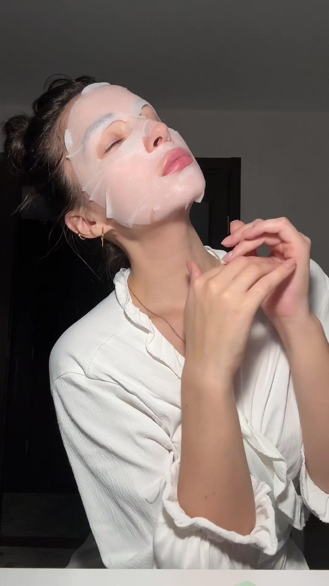 Woman With Facial Sheet Mask Relaxing