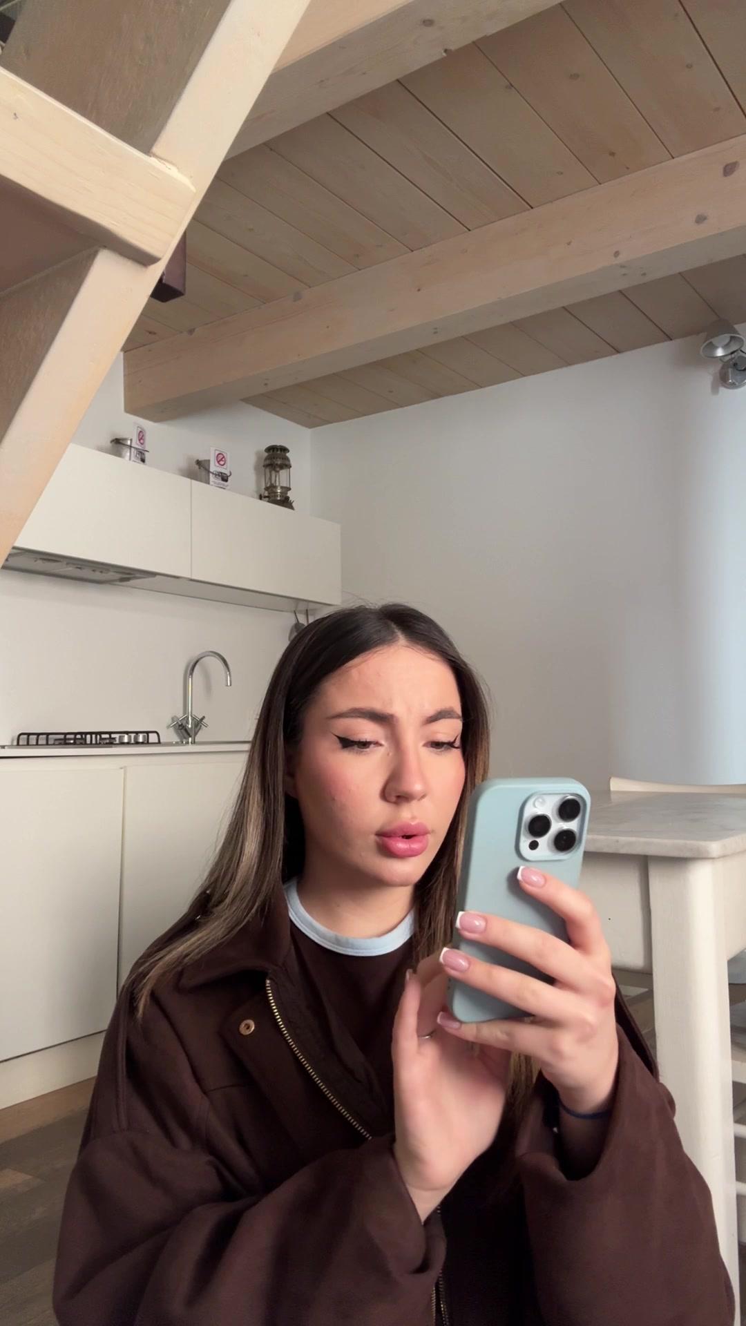 Woman reacts with surprise to phone