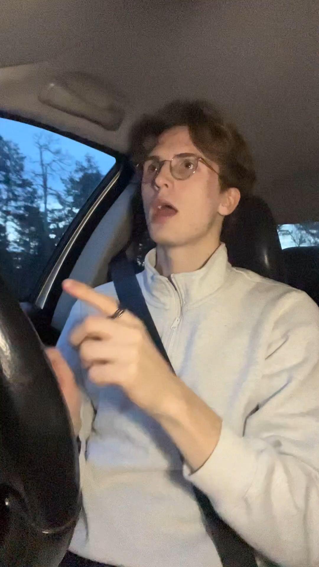 Young Man Driving and Singing