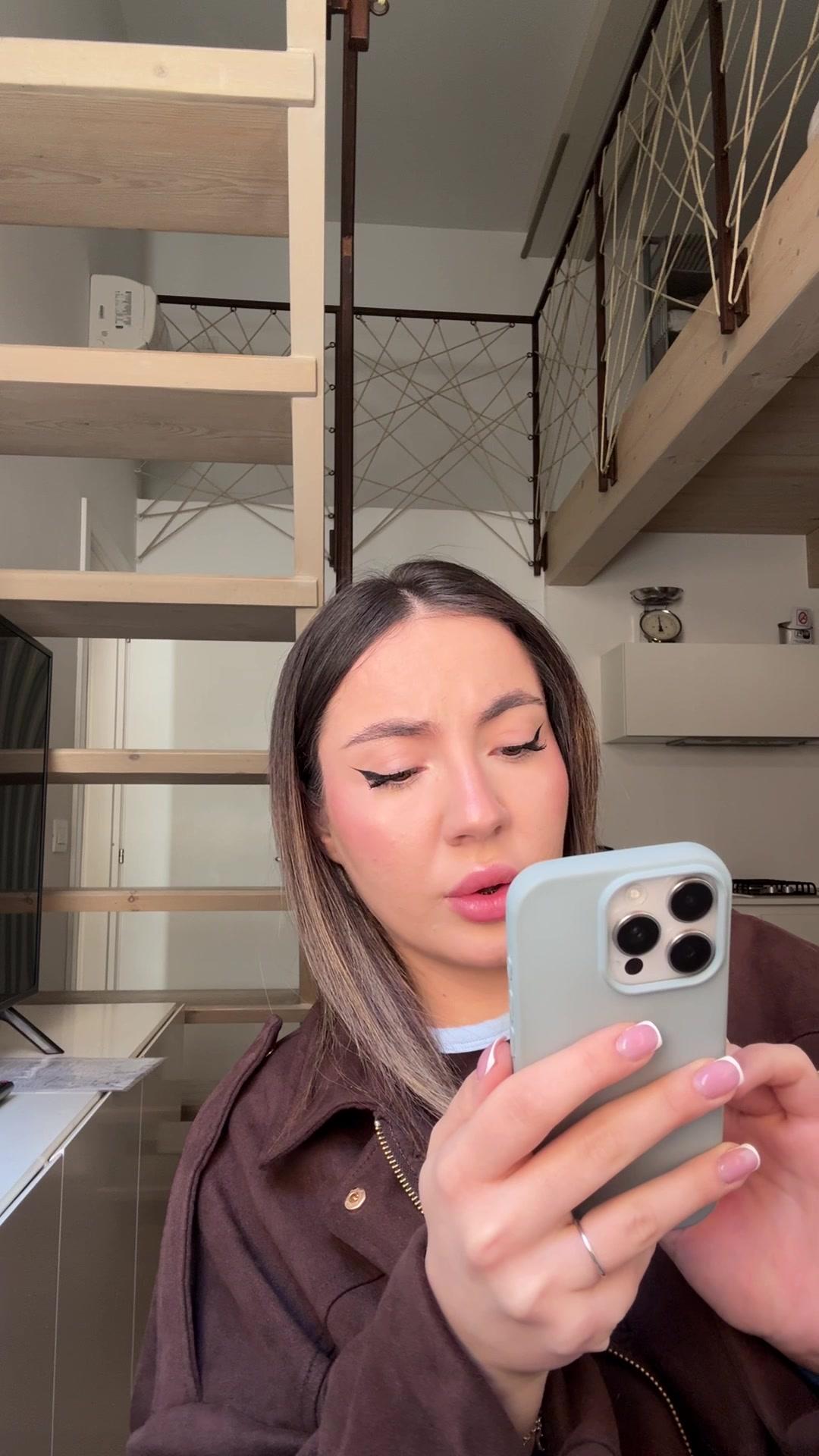 Girl Reacts with Hand Over Mouth