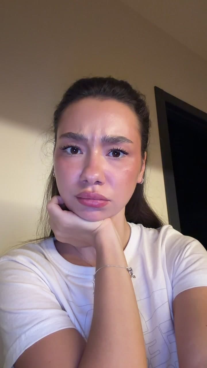 Young Woman Looking Confused At Camera